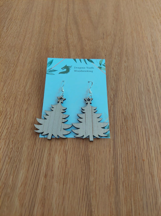 A front view of the Christmas tree earrings crafted from light, bright blonde solid Maple wood, displayed on an earring card.