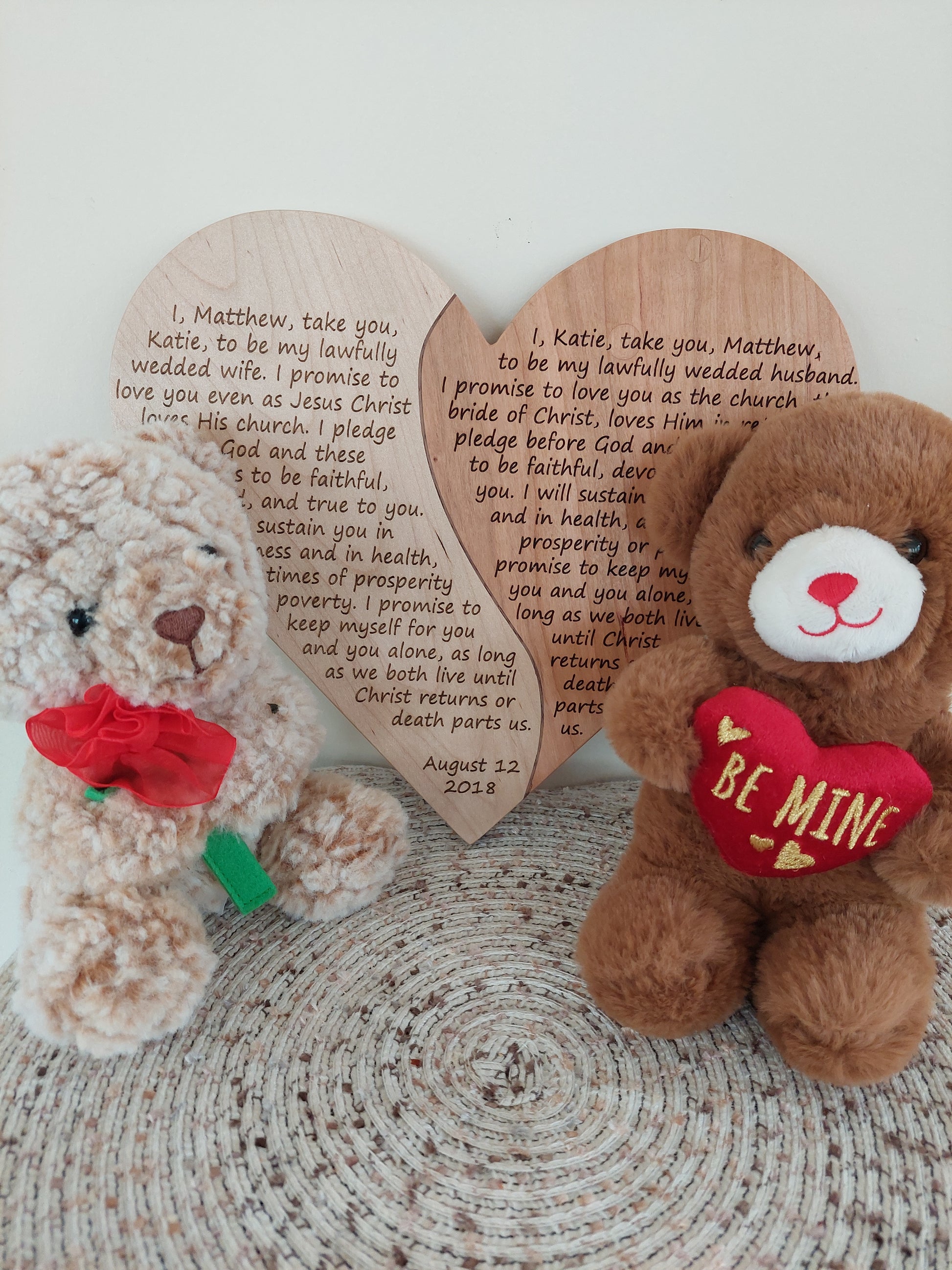 Front-facing view of a personalized heart-shaped cherry wood plaque engraved with custom wedding vows.