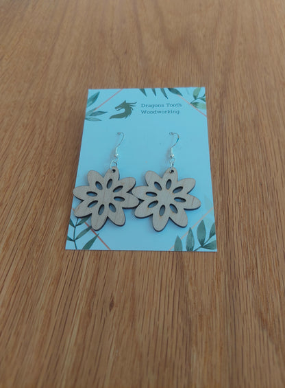 Bright blonde natural maple wood daisy dangle earrings featuring an open-centered retro floral cut-out design.