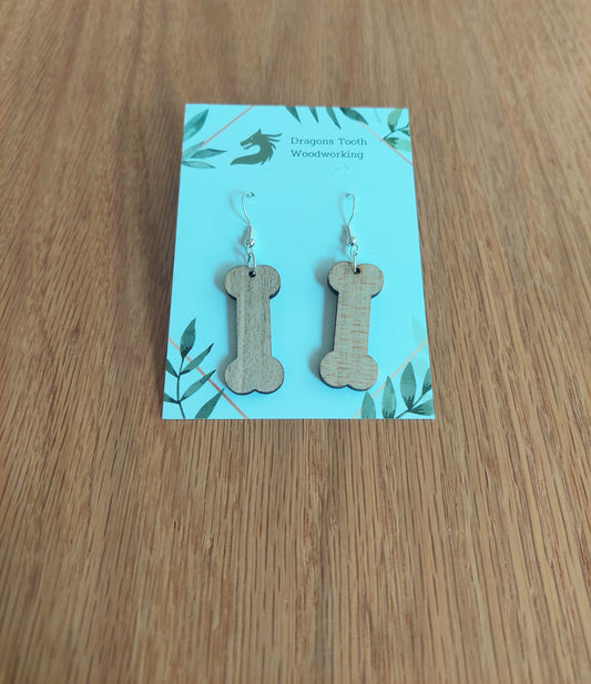 Light blonde natural maple wood dog bone earrings, a clean and minimalist pet-themed accessory handcrafted in Virginia.