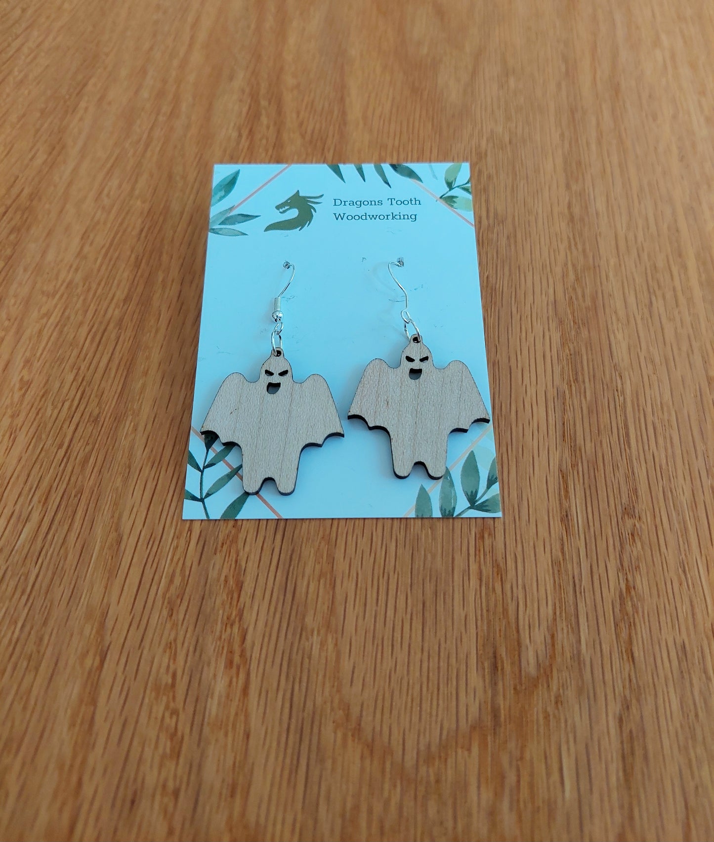 Pale blonde natural maple wood ghoul ghost earrings, a clean and cute spooky accessory handcrafted in Virginia.