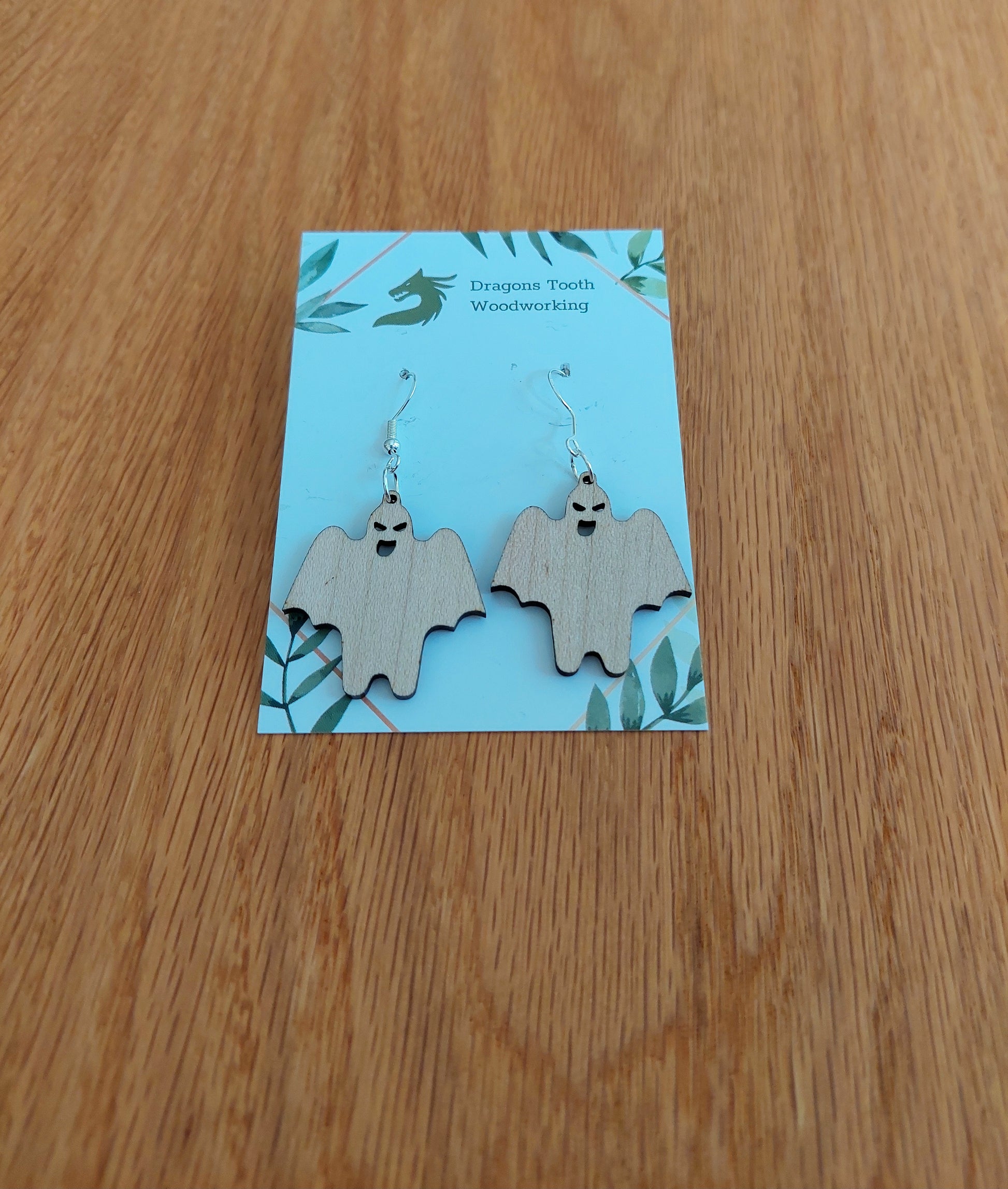 Pale blonde natural maple wood ghoul ghost earrings, a clean and cute spooky accessory handcrafted in Virginia.