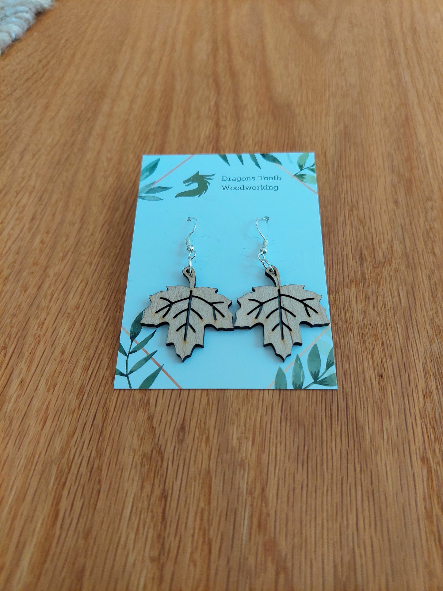 Light blonde maple wood maple leaf earrings, nature-inspired handcrafted wooden jewelry for women.