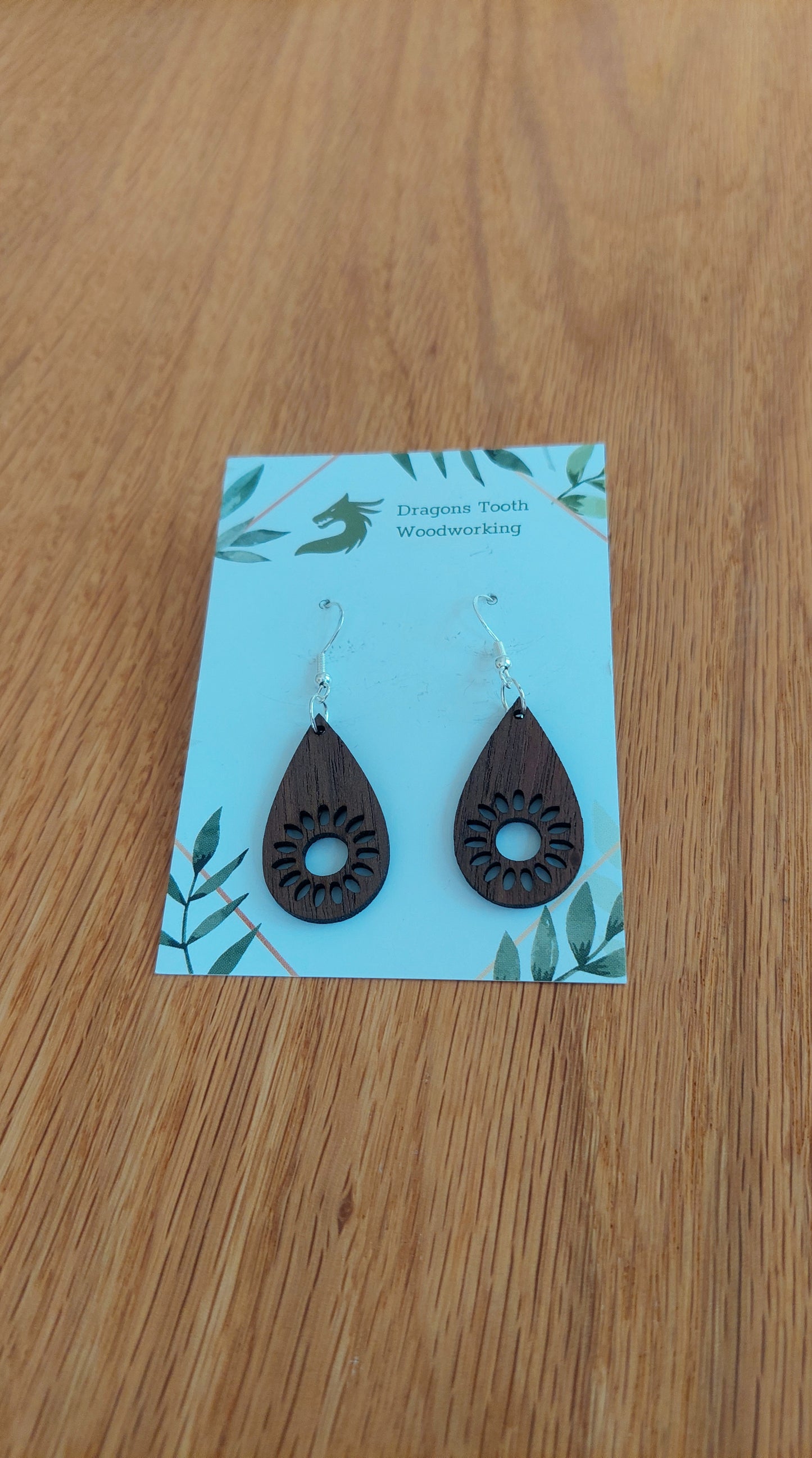Deep chocolate brown walnut wood sunflower earrings, a unique and elegant handcrafted bohemian botanical statement piece.