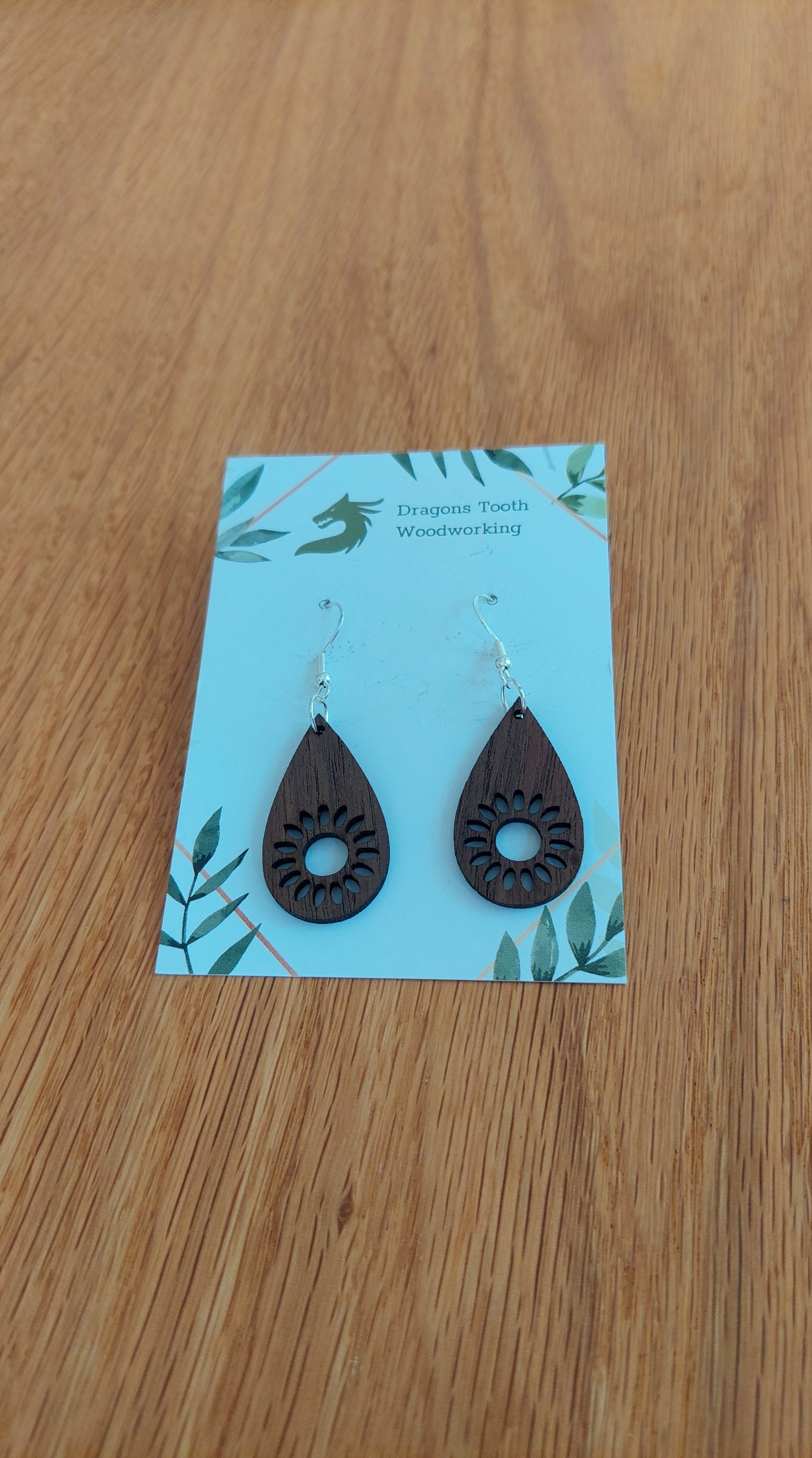 Deep chocolate brown walnut wood sunflower earrings, a unique and elegant handcrafted bohemian botanical statement piece.
