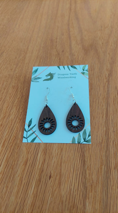 Deep chocolate brown walnut wood sunflower earrings, a unique and elegant handcrafted bohemian botanical statement piece.
