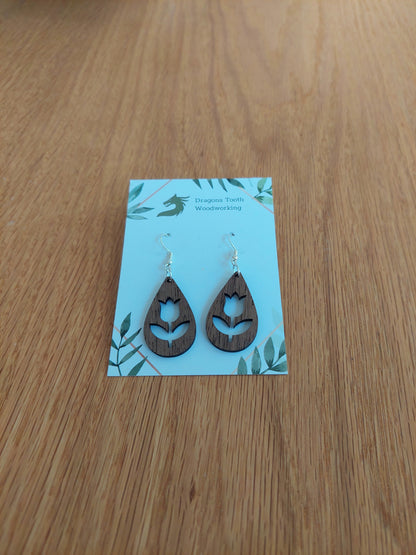 Deep chocolate brown walnut wood tulip earrings, a unique and elegant handcrafted botanical accessory.